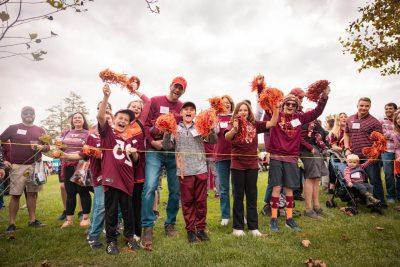 Hokies fans cheering at Holtzman Alumni Center